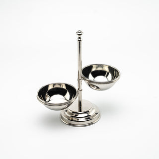 Handcrafted chrome-plated copper double bowl stand with a sleek, polished finish. Features two symmetrical bowls for serving snacks, nuts, or small accompaniments. Perfect for casual or elegant dining presentations.