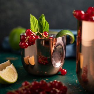 Handcrafted copper tumbler with a polished copper exterior and tin-lined interior, designed for hot and cold beverages. Elegant and functional drinkware with a timeless artisanal design.