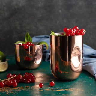 Polished copper tumbler handcrafted from pure copper with a tin-lined interior, designed for cocktails, juices, and beverages. Features a sleek, reflective finish for an elegant and timeless look.