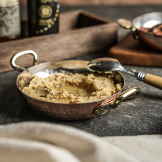 The sturdy brass handles are ergonomically designed for a comfortable, safe grip, adding both practicality and classic beauty to your cookware collection. Each piece is individually handcrafted, reflecting authentic artisanal quality and timeless elegance.