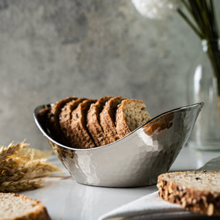 Handcrafted bread basket with hammered texture and sleek chrome-plated finish, perfect for serving bread, pastries, or as a stylish centerpiece on any dining table.