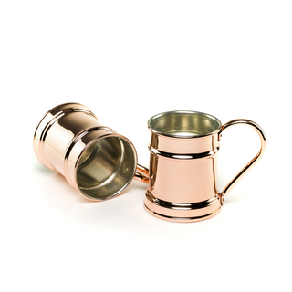 Set of two handcrafted copper beer tankards with a polished copper finish, tin-lined interior, and ergonomic handles, ideal for craft beers or as decorative pieces.