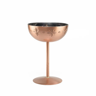 Handcrafted copper cocktail goblet adorned with ethnic-inspired hand-engraved patterns, featuring a tin-lined interior and a slender stem, ideal for serving cocktails or champagne.