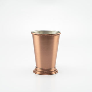 Handcrafted solid copper julep cup with a brushed finish, hand-etched detailing on the rim and base, and a tin-lined interior, ideal for cocktails or decorative use.