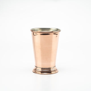 Handcrafted solid copper Mint Julep cup with a polished mirror-like finish, hand-etched detailing, and a food-safe tin lining, ideal for cocktails or refreshing drinks.