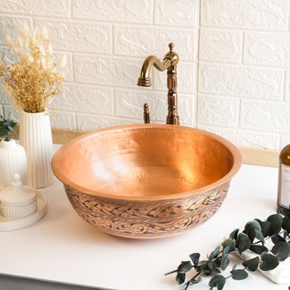 Handmade matte copper vessel sink with intricate hand-engraved detailing, farmhouse style, and included drain cap, perfect for bathroom or kitchen vanities.