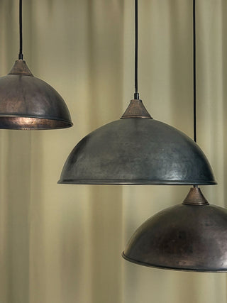 Handmade farmhouse copper pendant light with a dark copper finish, available in 12", 14", and 16" sizes, includes solid copper fittings and a textile cord for easy installation.