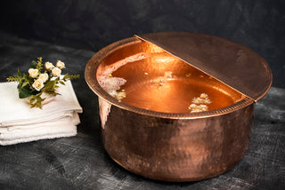 Handmade solid copper foot bath with a hammered finish and removable footrest, available in sizes 12"–20", ideal for pedicures, spa treatments, and foot soaking.